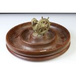 Novelty turned wooden nut dish mounted with a brass ship's wheel nutcracker, approx 29cm diameter