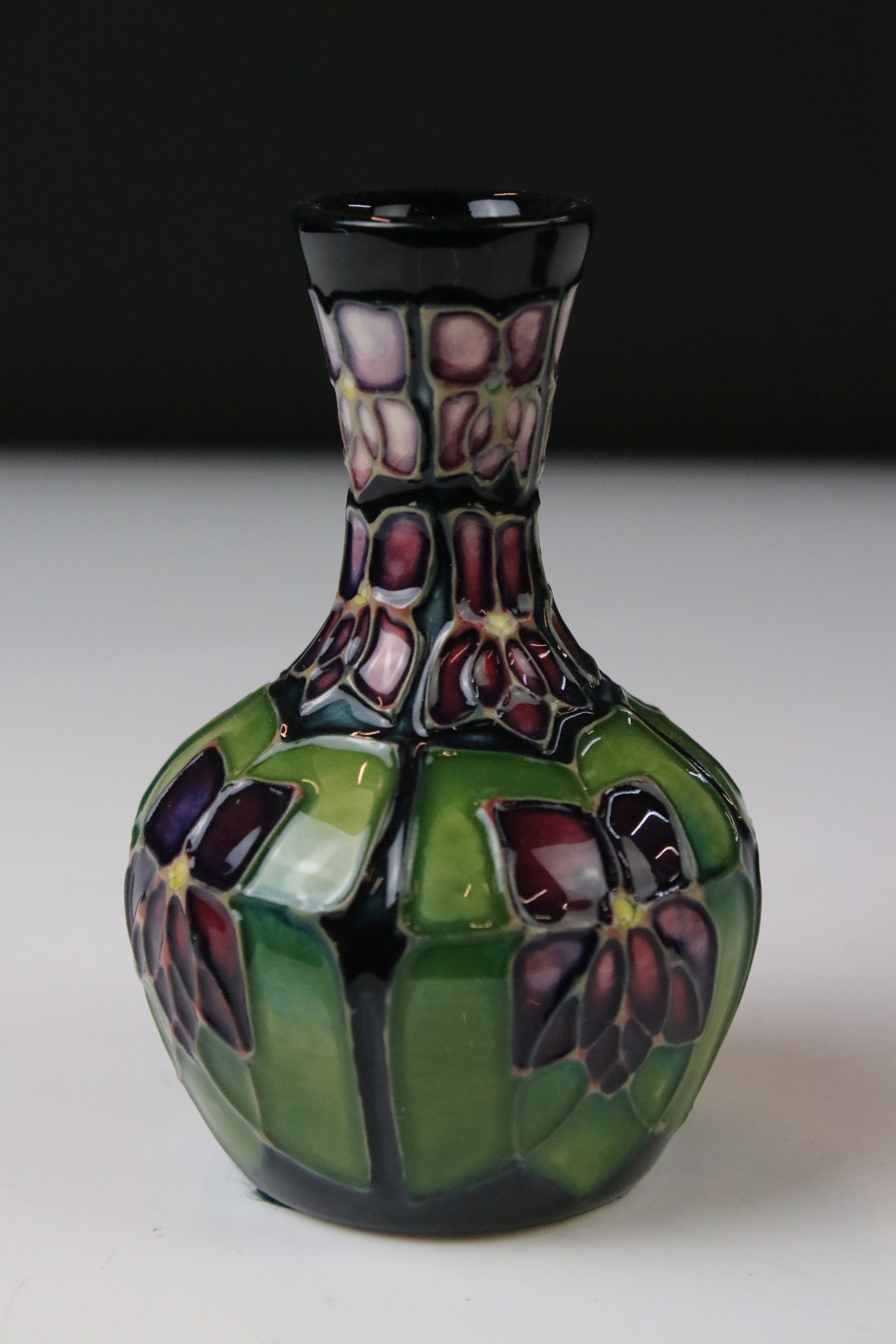 Two Moorcroft pottery vases of bulbous form to include a Violets pattern example on blue ground, - Image 2 of 8