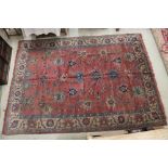 Large Brown Ground Rug with stylised floral pattern within a border, approximately 370cm x 280cm