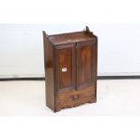 Late 19th / Early 20th century Oak Smoker Cabinet, the two doors opening to a fitted interior,