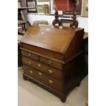 George III Mahogany Bureau, the fall front opening to a well fitted interior of pigeon holes,