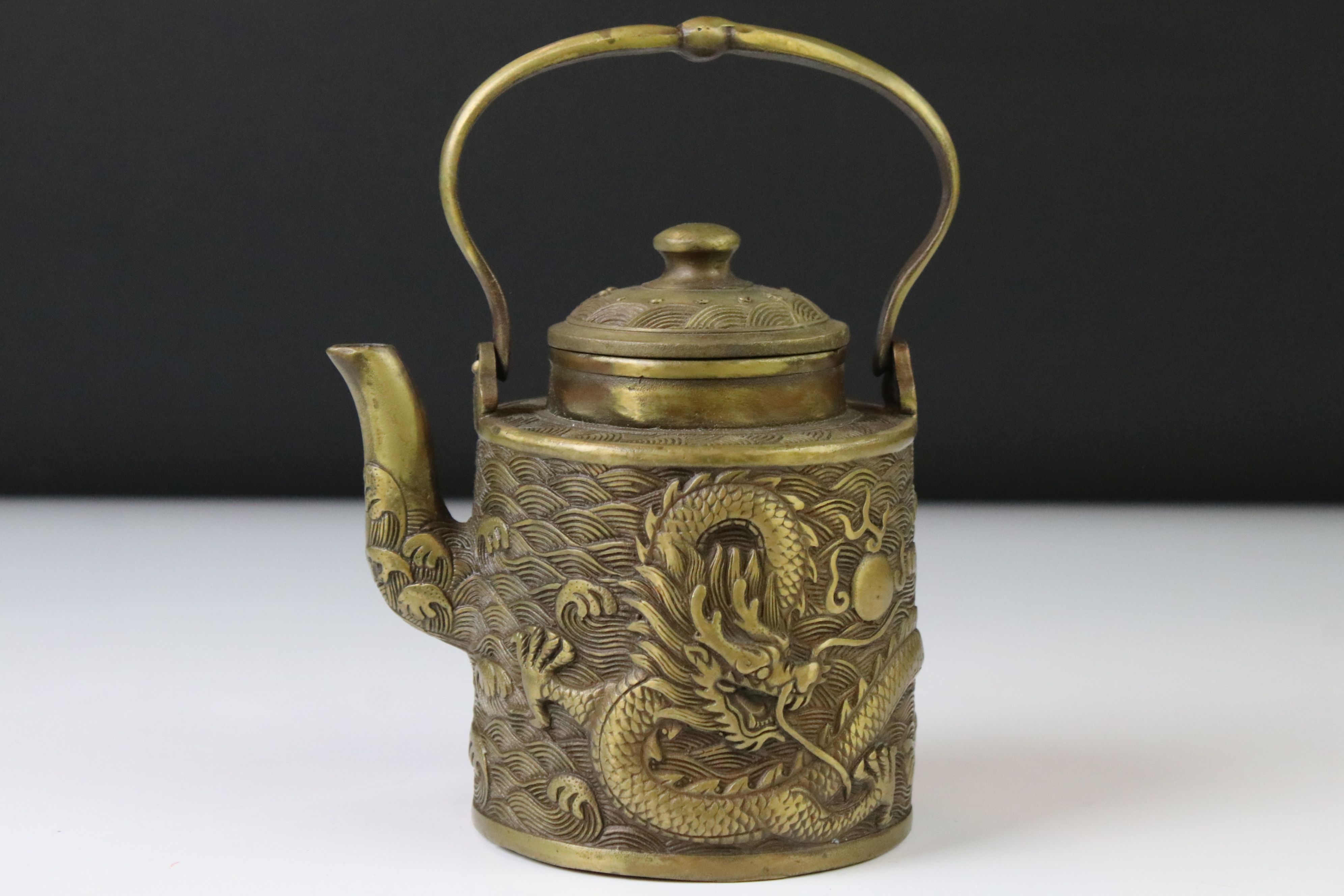 Chinese bronze teapot & cover with relief dragon and wave decoration, hinged handle, 4 character