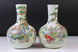 Pair of Chinese Porcelain Famille Verte bottle vases, with enamel decoration depicting figures in