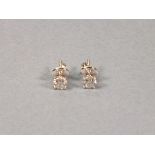 A pair of diamond ear studs, claw set in 18ct white gold, 1.04ct