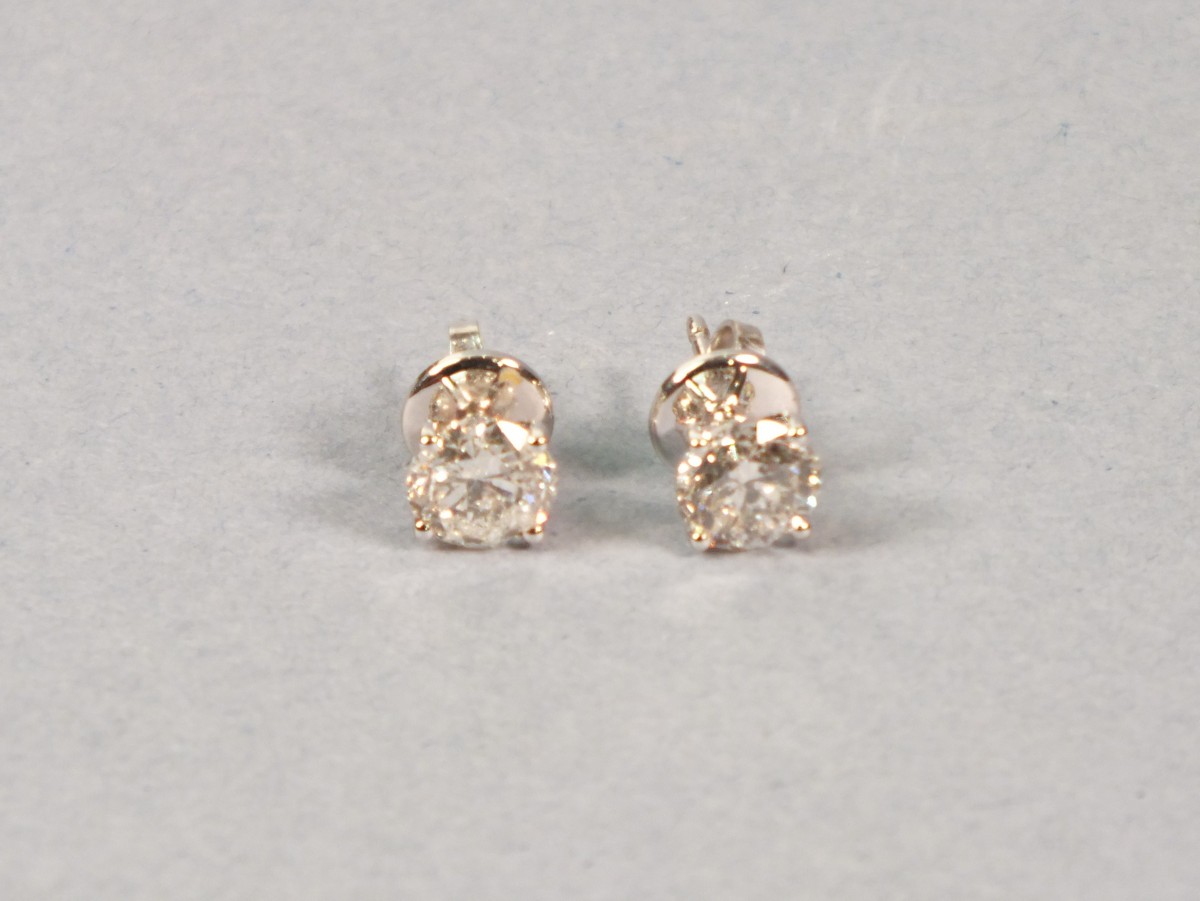 A pair of diamond ear studs, the round brilliant cut stones claw set in 18ct white gold, 2.08ct,