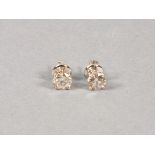 A pair of diamond ear studs, the round brilliant cut stones claw set in 18ct white gold, 2.08ct,