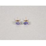 A pair of tanzanite ear studs, the oval cut stones claw set in silver, 1.5gms