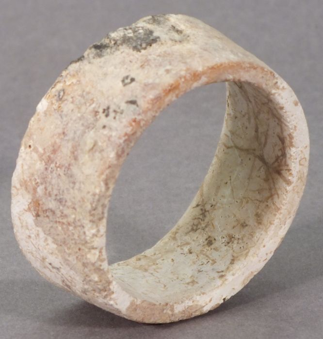 A Ban Chiang bracelet 2nd-1st millennium BC, white/pink mottled hardstone, 1.75" (4.5cm) internal - Image 2 of 3