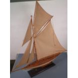 A late 20th Century model pond yacht,  gaff rigged, with a white hull to waterline, 37" (94cm) high