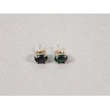 A pair of black opal ear studs, the cabochon cut stones claw set in silver, 1.2gms