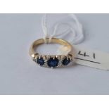 A sapphire and diamond nine stone ring set in gold size N - 3 gms