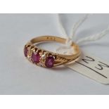 A ruby and diamond seven stone ring 18ct gold size N 1/2 - 3.1 gms