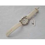A unisex wrist watch by Chanel J12 automatic with seconds sweep and date appature