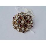 A antique silver austro Hungarian brooch set with pearls and garnets