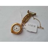 A HEART SHAPED LADIES FOB WATCH 14CT GOLD ON SURSPENTION CHAIN AND BAR