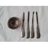 Four silver handled manicure items and a unmarked tea strainer