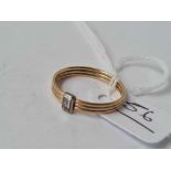 A two colour gold baguette diamond ring 18ct gold (tested) size N 1/2 - 1.7 gms