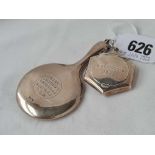 A miniature hand mirror B'ham 1924 and a small compact with mirror interior