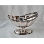 A boat shaped sugar basin with reeded rims handle and pedestal base 5 1/4 inches wide London 1909 by