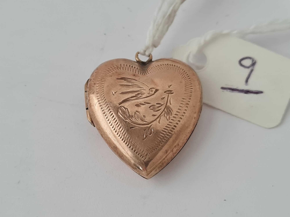 A back and front heart shaped locket in 9ct