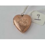 A back and front heart shaped locket in 9ct
