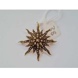 An antique 14ct gold and pearl star burst pendant brooch 6.9g