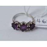 A white gold three stone amethyst ring 9ct size N - 3.1 gms