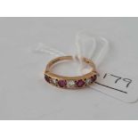 A seven stone ruby and diamond ring 9ct size N - 1.8 gms