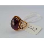 A cabochon garnet ring size F