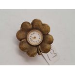 A unusual watch/clock in the form of a flower head in metal