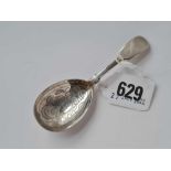A Georgian fiddle pattern caddy spoon with foliage engraved bowl London 1827 by IHD