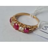 A VICTORIAN RUBY AND DIAMOND RING (DIAMONDS APPROX. 25 PTS EACH) 18CT GOLD SIZE P 1/2 - 4.2 GMS