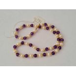 A amethyst and pearl bead necklace with 9ct clasp