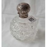 A circular scent bottle with hinged cover and cut glass body B'ham 1888