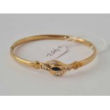 A multi stone set 9ct hinged bangle 8.2g