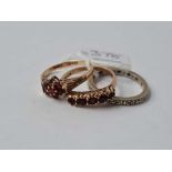 Two gold red stone rings together with a eternity ring 9ct - 6.2 gms