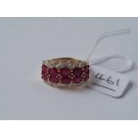 A ten stone ruby and diamond ring set in gold size Q - 4.4 gms