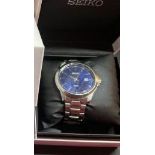 Gents Seiko 100m wrist watch with black dial, seconds sweep & date aperture. In original box with