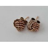 A pair of 9ct knot earrings - 1.6 gms