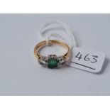 A three stone emerald and diamond ring 18ct gold size J - 3.1 gms