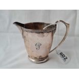 A circular cream jug with decorated rim foot 31/2 inches high B'ham 1931 - 127 gms