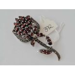 A large 8cm long silver and garnet brooch 21g inc