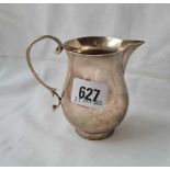 A 18th century style cream jug with scroll handle and rim foot Chester 1938 by S&I - 149 gms