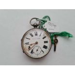 A gents large silver pocket watch with key "improved patent" with seconds dial enamel face damaged