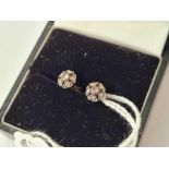 A boxed pair antique gold and diamond cluster earrings with screw backs