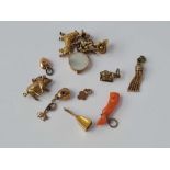 Assorted gold and coral and metal charms