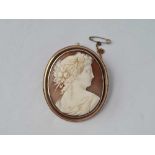 A Victorian gold mounted shell cameo brooch of classical goddess