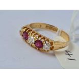 A ANTIQUE FIVE STONE DIAMOND AND RUBY HALF HOOP RING B'HAM 1919 SIZE O