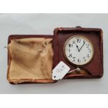 Minute repeater bedside clock in leather travelling case, the case being in poor condition