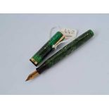 A mottled green Watermans fountain pen